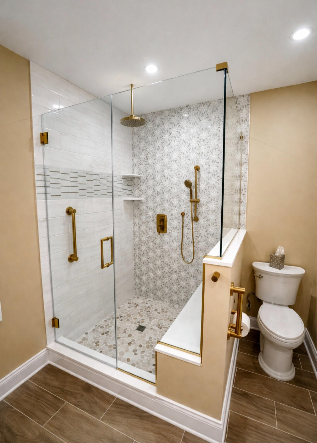 Frameless glass shower door with brushed brass hardware installed by Crystal Vision Glass in New Jersey